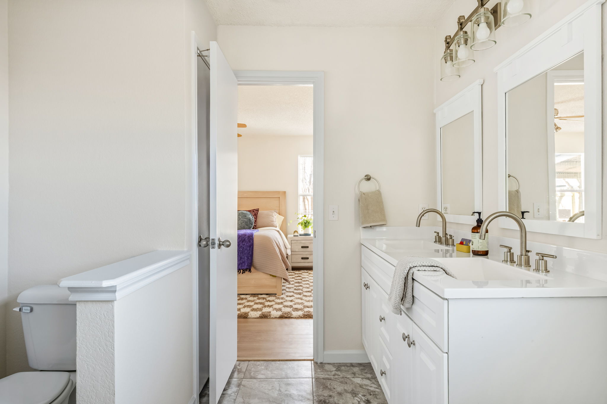 161 Segovia Way Pflugerville, TX 78660 - Photo 22 of 37 a en suite bathroom with sink a mirror and toilet