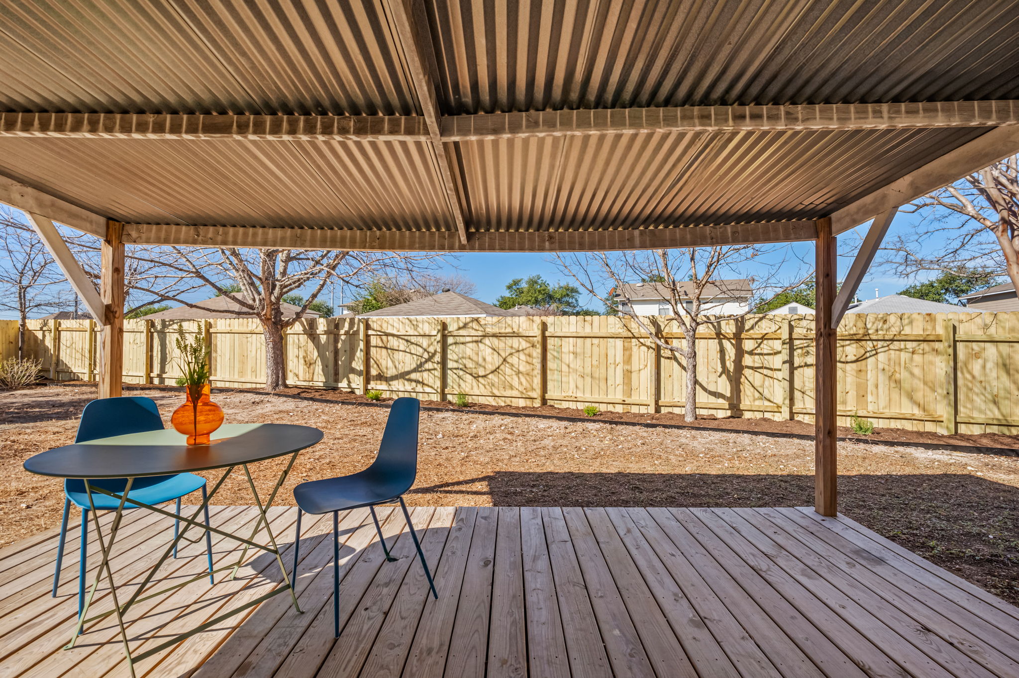 161 Segovia Way Pflugerville, TX 78660 - Photo 29 of 37 a view of a patio with table and chairs with wooden floor