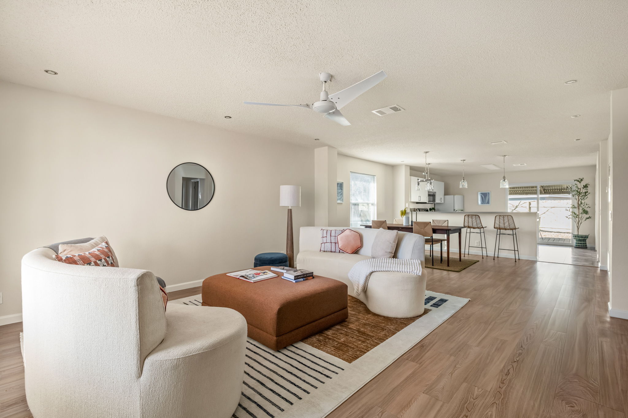 161 Segovia Way Pflugerville, TX 78660 - Photo 3 of 37 a living room with furniture and a wooden floor