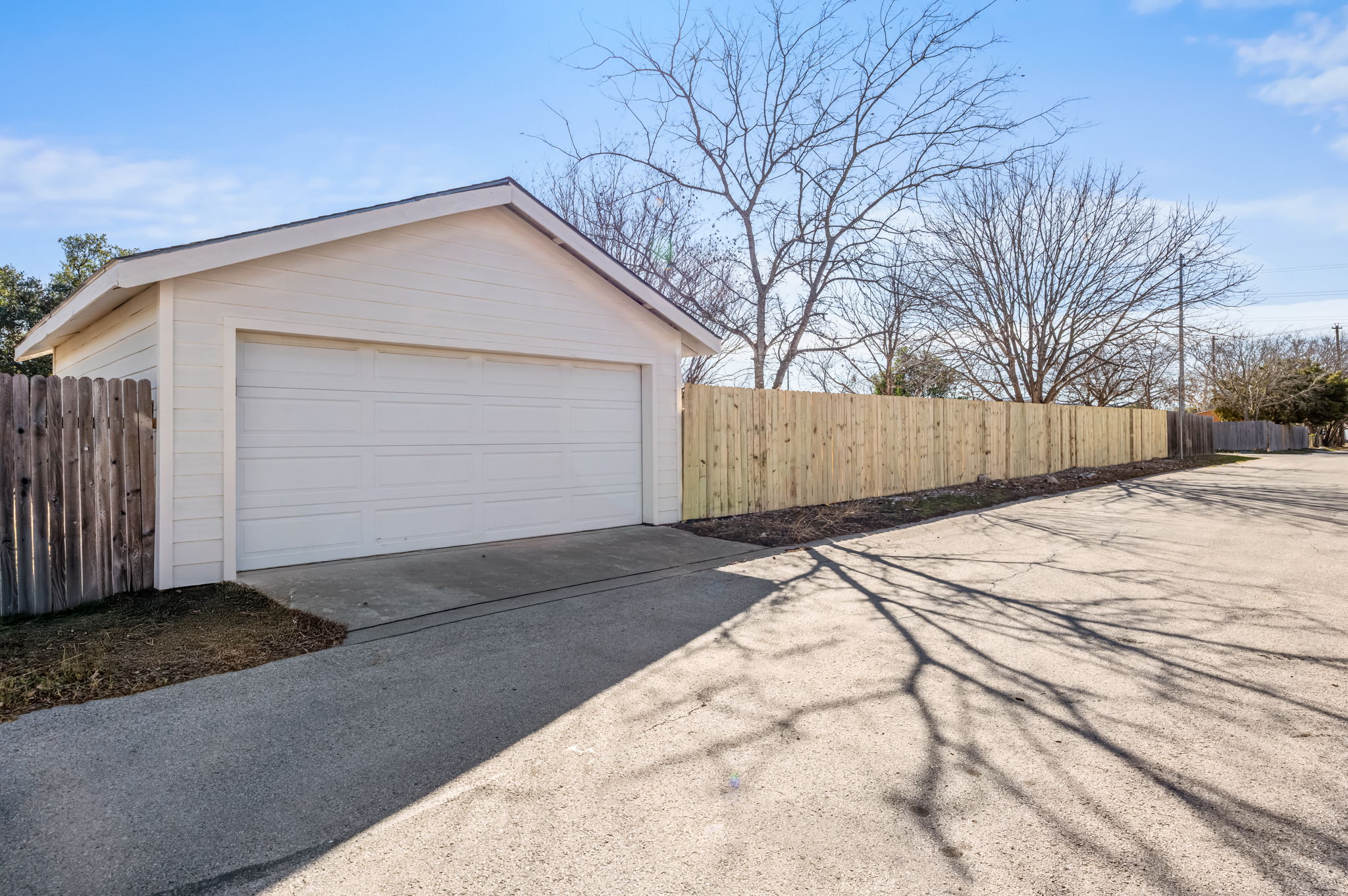 161 Segovia Way Pflugerville, TX 78660 - Photo 36 of 37 a view of garage and wooden fence