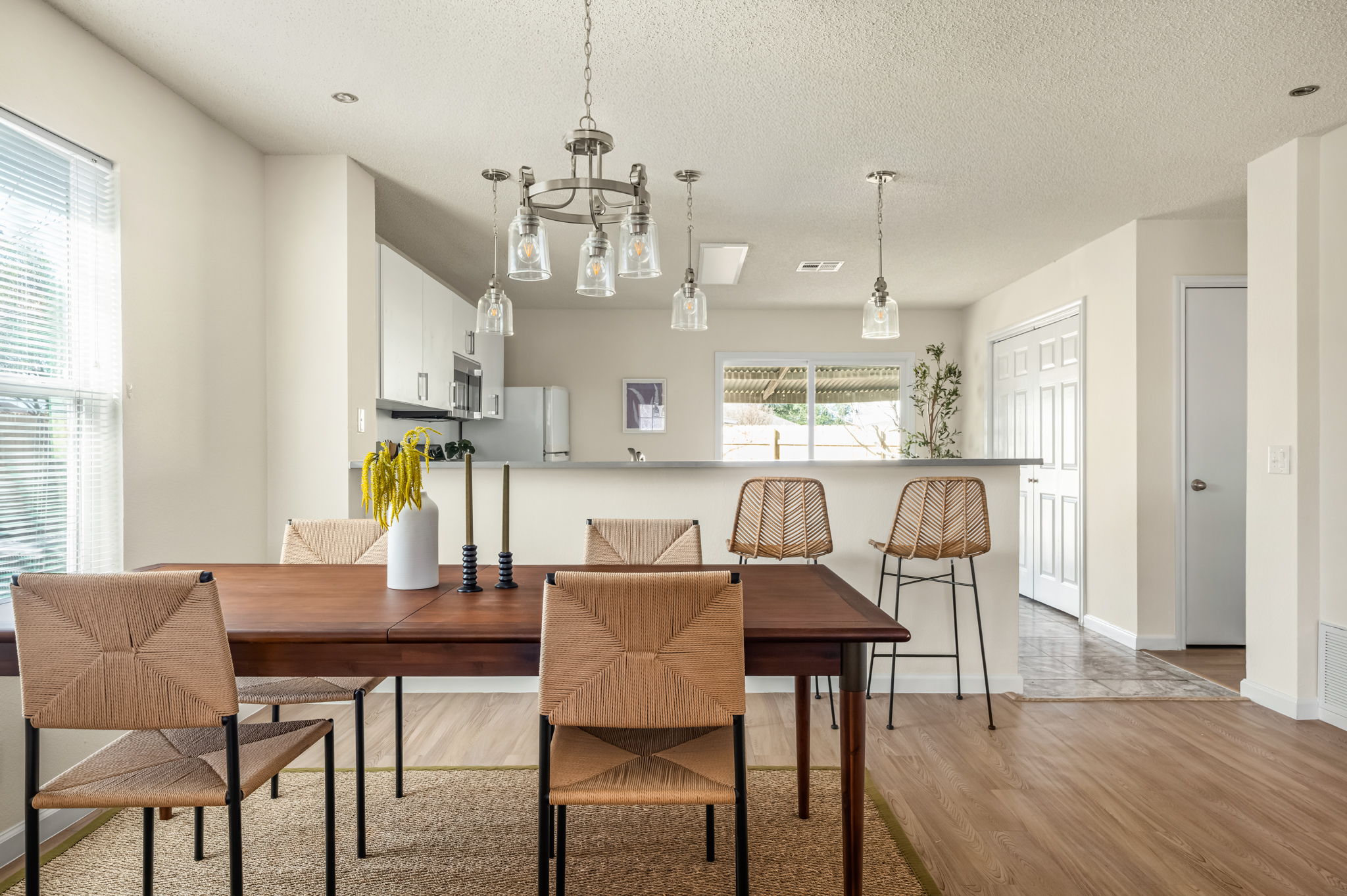161 Segovia Way Pflugerville, TX 78660 - Photo 9 of 37 a view of a dining room with furniture a chandelier and wooden floor