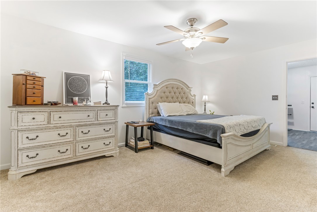 404 Davis Road Liberty, SC 29657 - Photo 20 of 39 A restful chamber offers soft carpeted flooring, a large window, and a convenient ceiling fan.