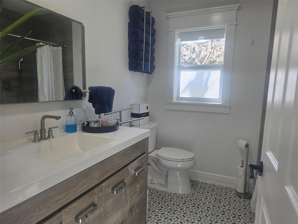 13091 Old Crystal River Road Brooksville, FL 34601 - Photo 11 of 30 a bathroom with a sink vanity granite and toilet