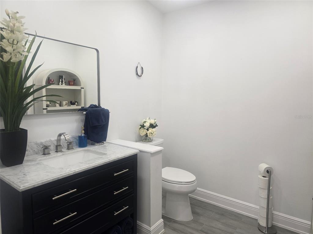 13091 Old Crystal River Road Brooksville, FL 34601 - Photo 15 of 30 a bathroom with a sink toilet and vanity