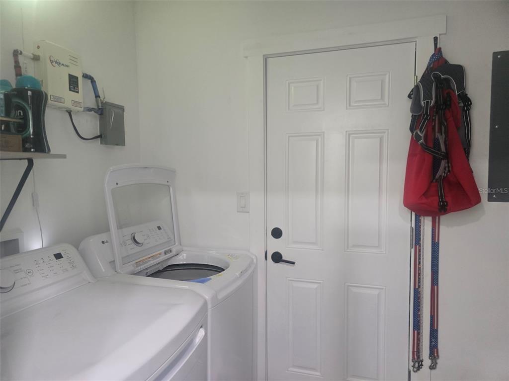 13091 Old Crystal River Road Brooksville, FL 34601 - Photo 16 of 30 a bathroom with a sink vanity and shower