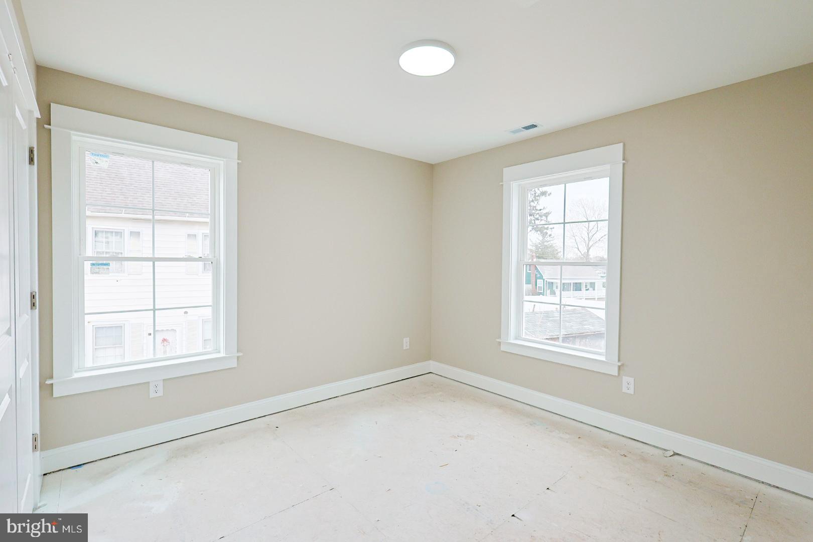 104 Front Street Frederica, DE 19946 - Photo 9 of 11 an empty room with windows