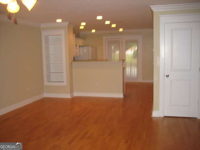 1035 South Barnett Shoals Road, Unit 713 Athens, GA 30605 - Photo 2 of 14 a view of empty room with wooden floor