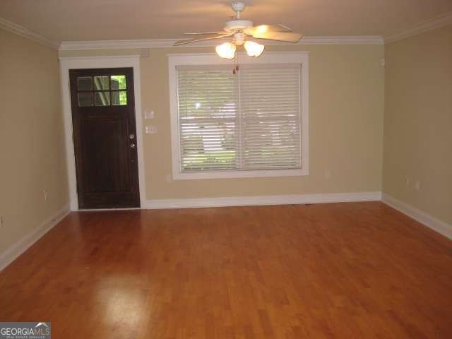 1035 South Barnett Shoals Road, Unit 713 Athens, GA 30605 - Photo 6 of 14 en empty room with windows and ceiling fan