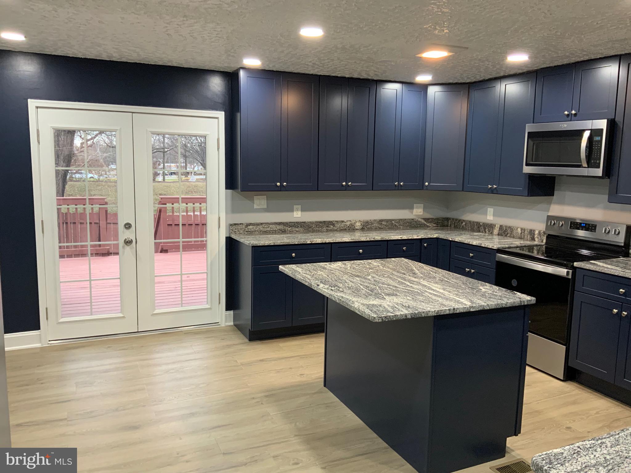 9414 Taney Road Manassas, VA 20110 - Photo 11 of 46 KITCHEN LEADS TO HUGE REAR DECK