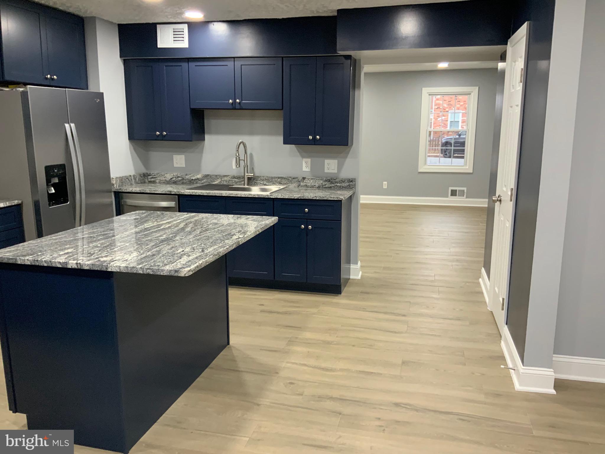 9414 Taney Road Manassas, VA 20110 - Photo 13 of 46 a kitchen with stainless steel appliances granite countertop a sink counter space and cabinets