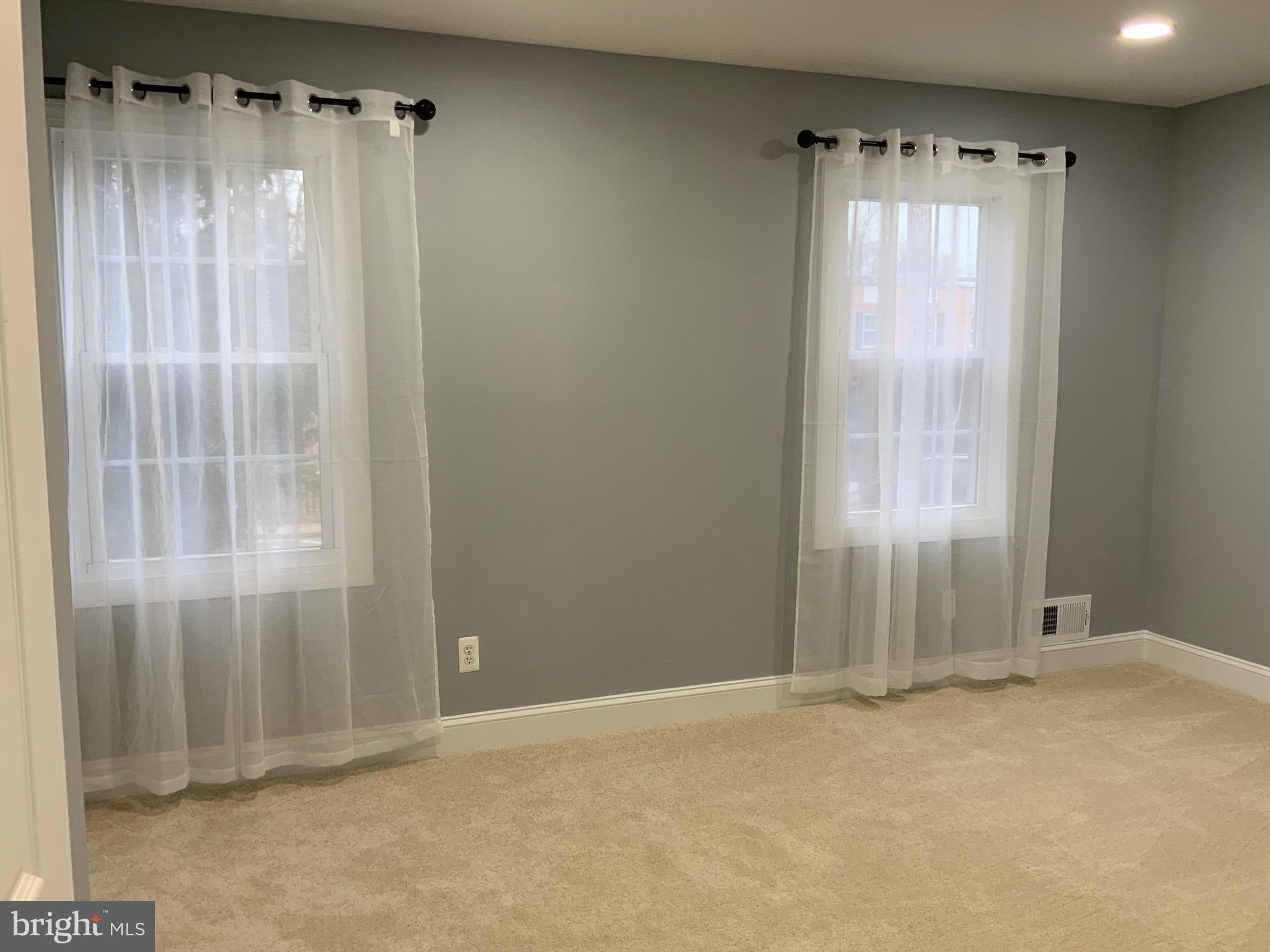 9414 Taney Road Manassas, VA 20110 - Photo 15 of 46 a view of an empty room with a window