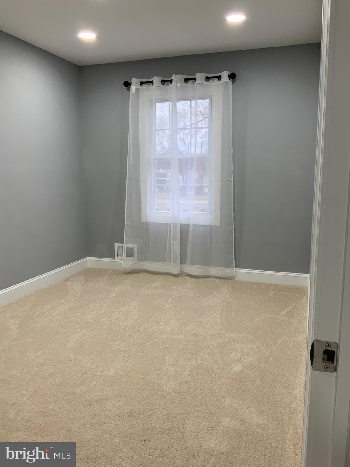 9414 Taney Road Manassas, VA 20110 - Photo 20 of 46 a view of an empty room with a window