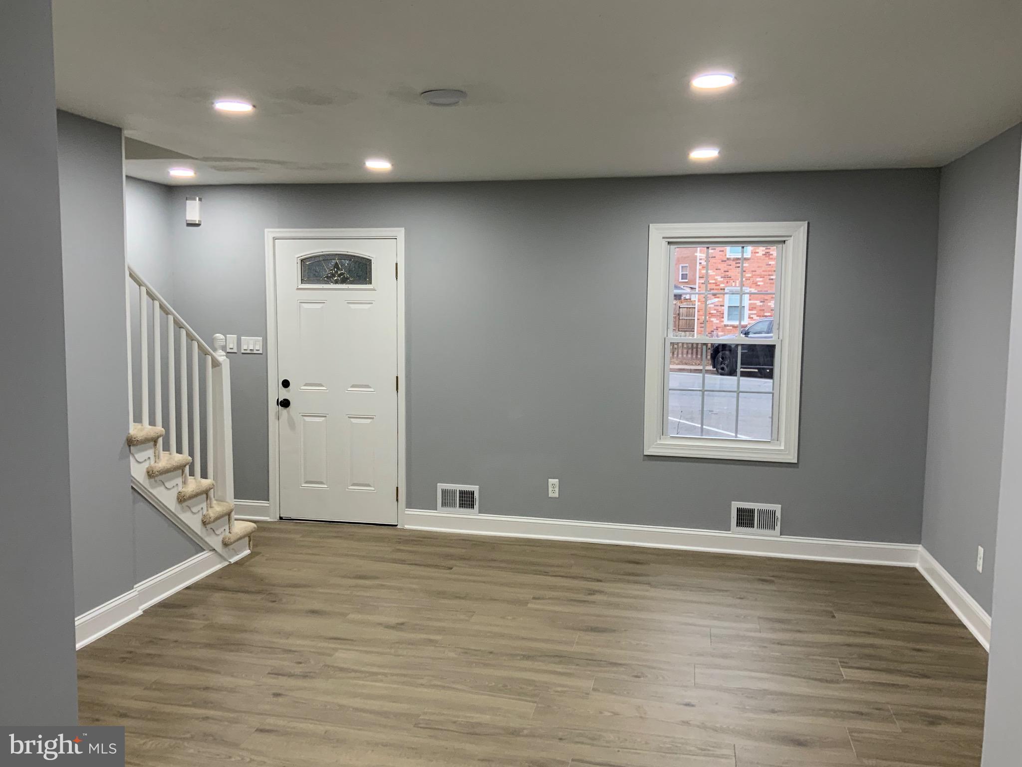 9414 Taney Road Manassas, VA 20110 - Photo 2 of 46 an empty room with wooden floor and windows