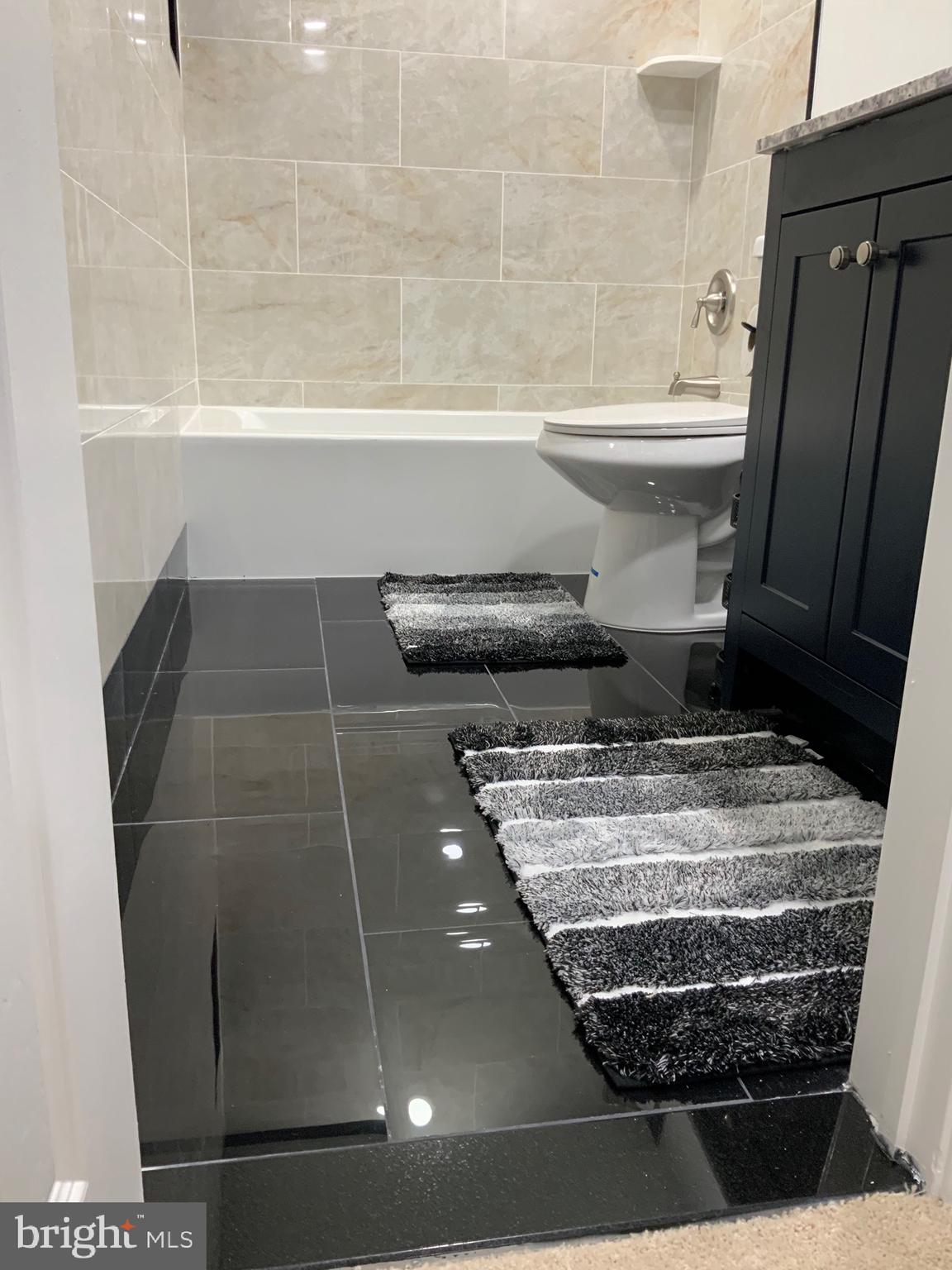 9414 Taney Road Manassas, VA 20110 - Photo 23 of 46 a bathroom with a sink and a vanity