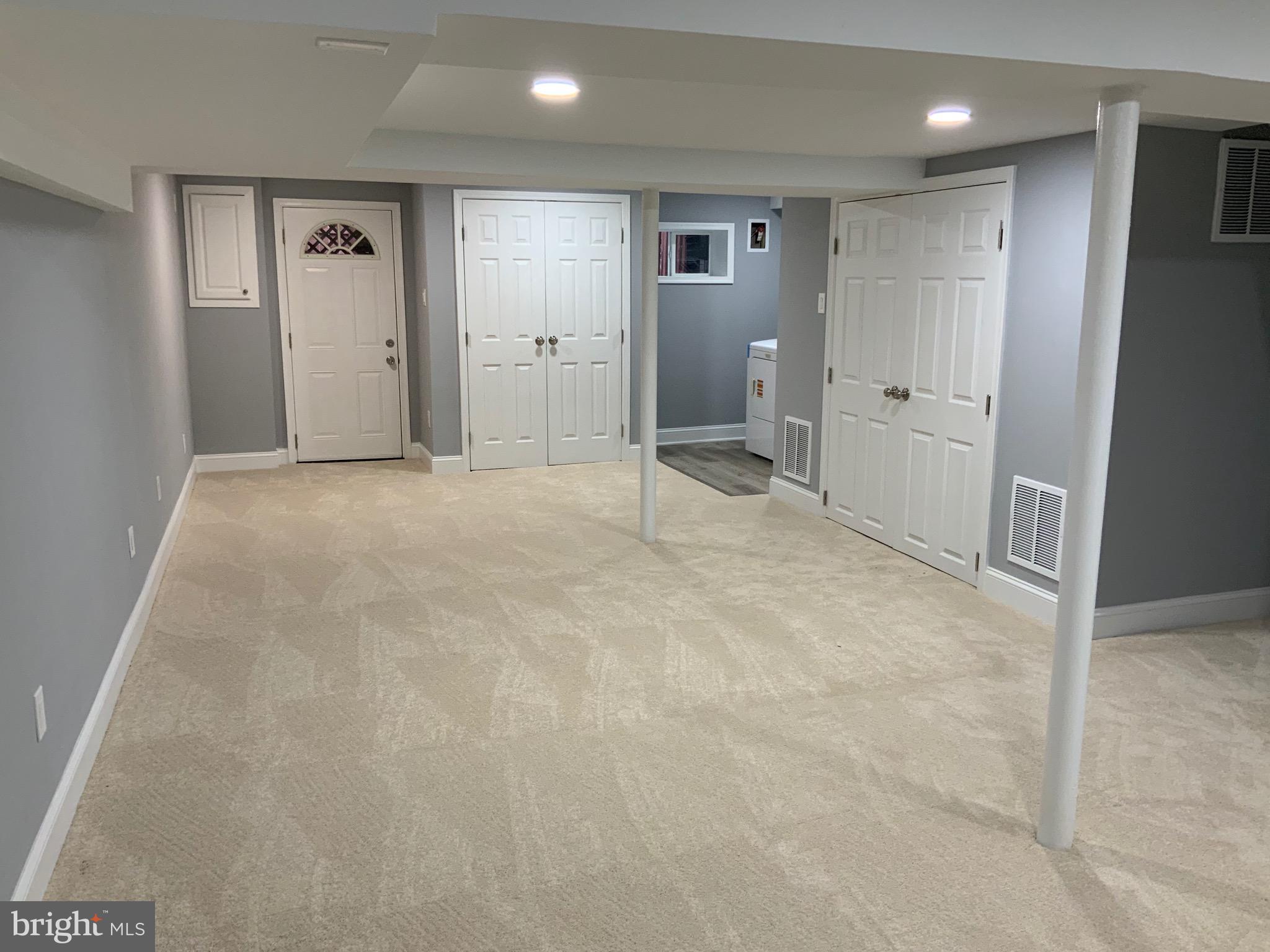 9414 Taney Road Manassas, VA 20110 - Photo 27 of 46 BASMENT WITH 60 INCH CLOSET DOOR TO BACK YARD