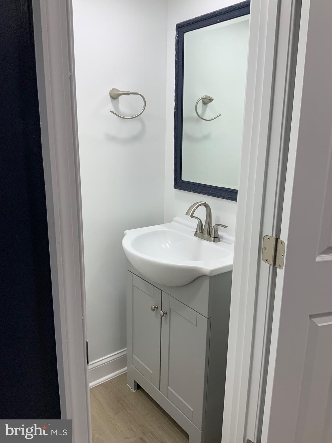 9414 Taney Road Manassas, VA 20110 - Photo 31 of 46 a bathroom with a sink and a mirror