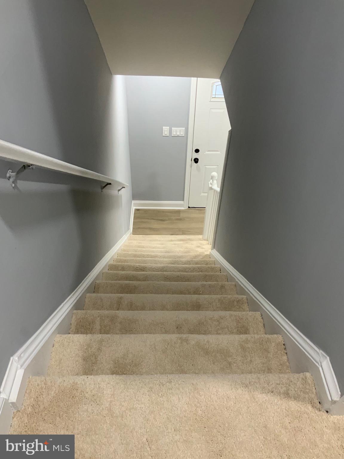 9414 Taney Road Manassas, VA 20110 - Photo 4 of 46 a view of staircase with white walls