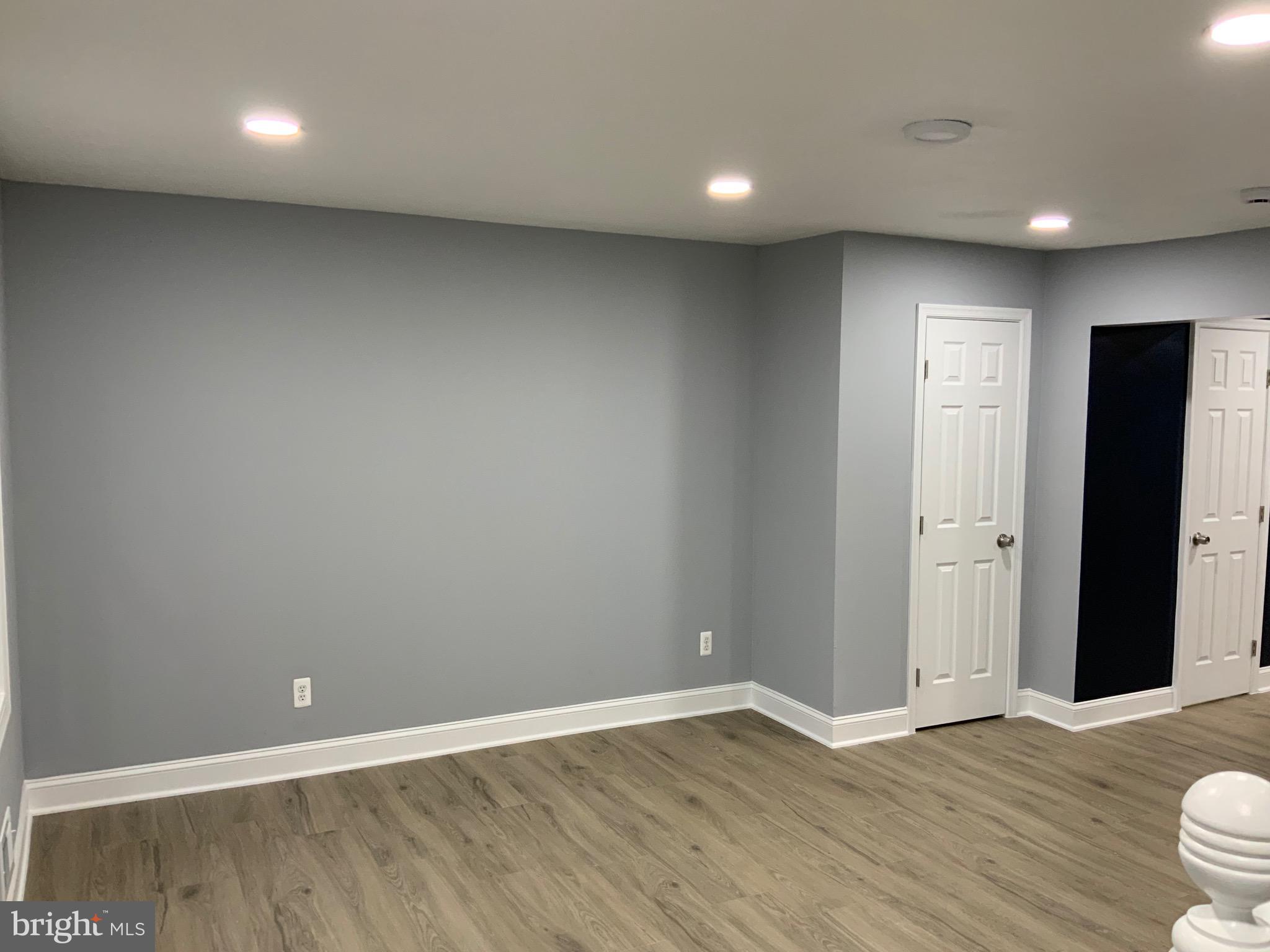 9414 Taney Road Manassas, VA 20110 - Photo 6 of 46 a view of an empty room with wooden floor