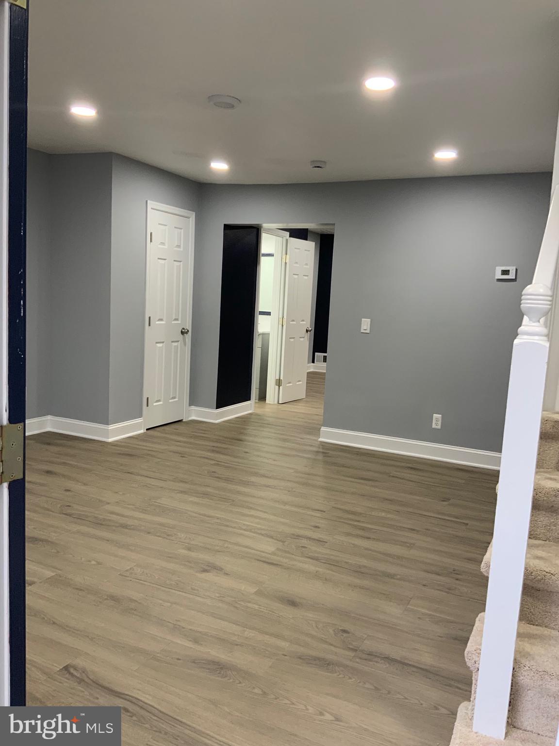 9414 Taney Road Manassas, VA 20110 - Photo 7 of 46 a view of an empty room with wooden floor