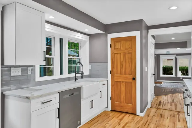 a kitchen with a sink and a large window