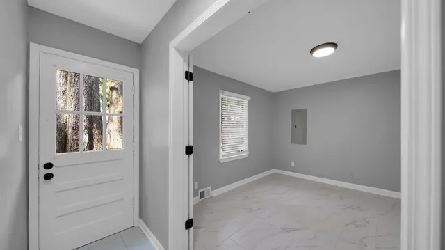 a view of an empty room with a window