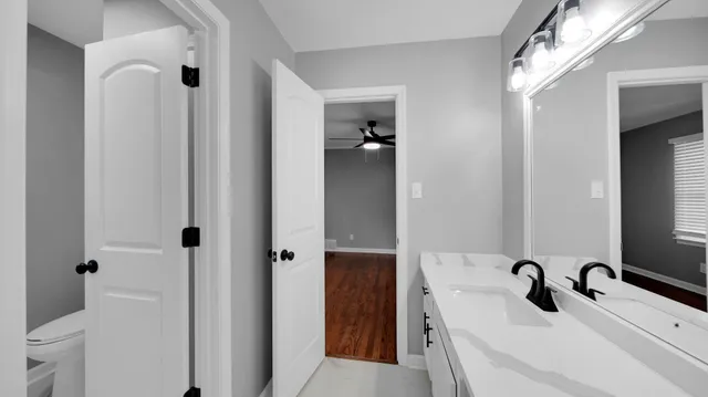 a bathroom with a sink and mirror