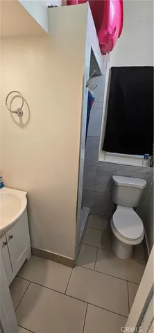 a living room with furniture stairs and a couch