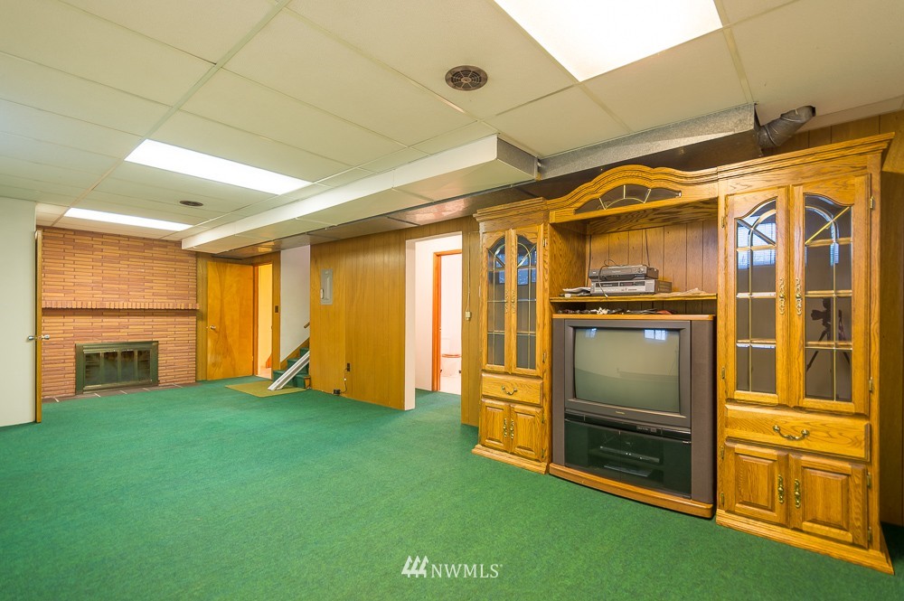 109 Kennicott Road Chehalis, WA 98532 - Photo 19 of 23 a view of an empty room with a fireplace and a window