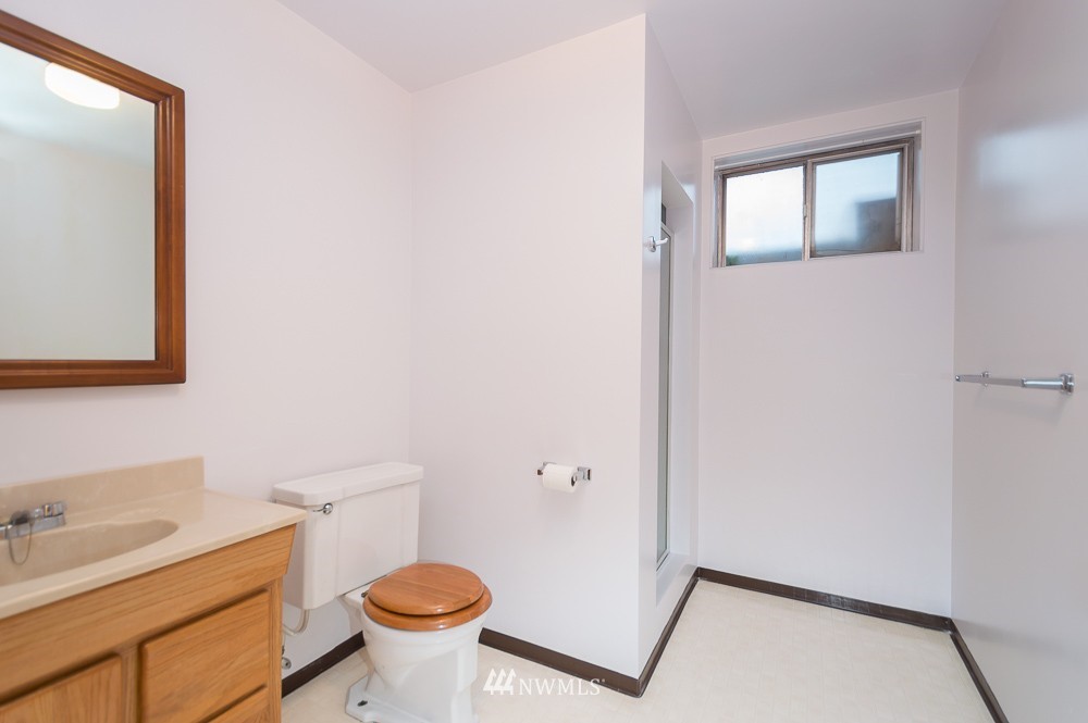 109 Kennicott Road Chehalis, WA 98532 - Photo 21 of 23 a bathroom with a sink toilet and a mirror
