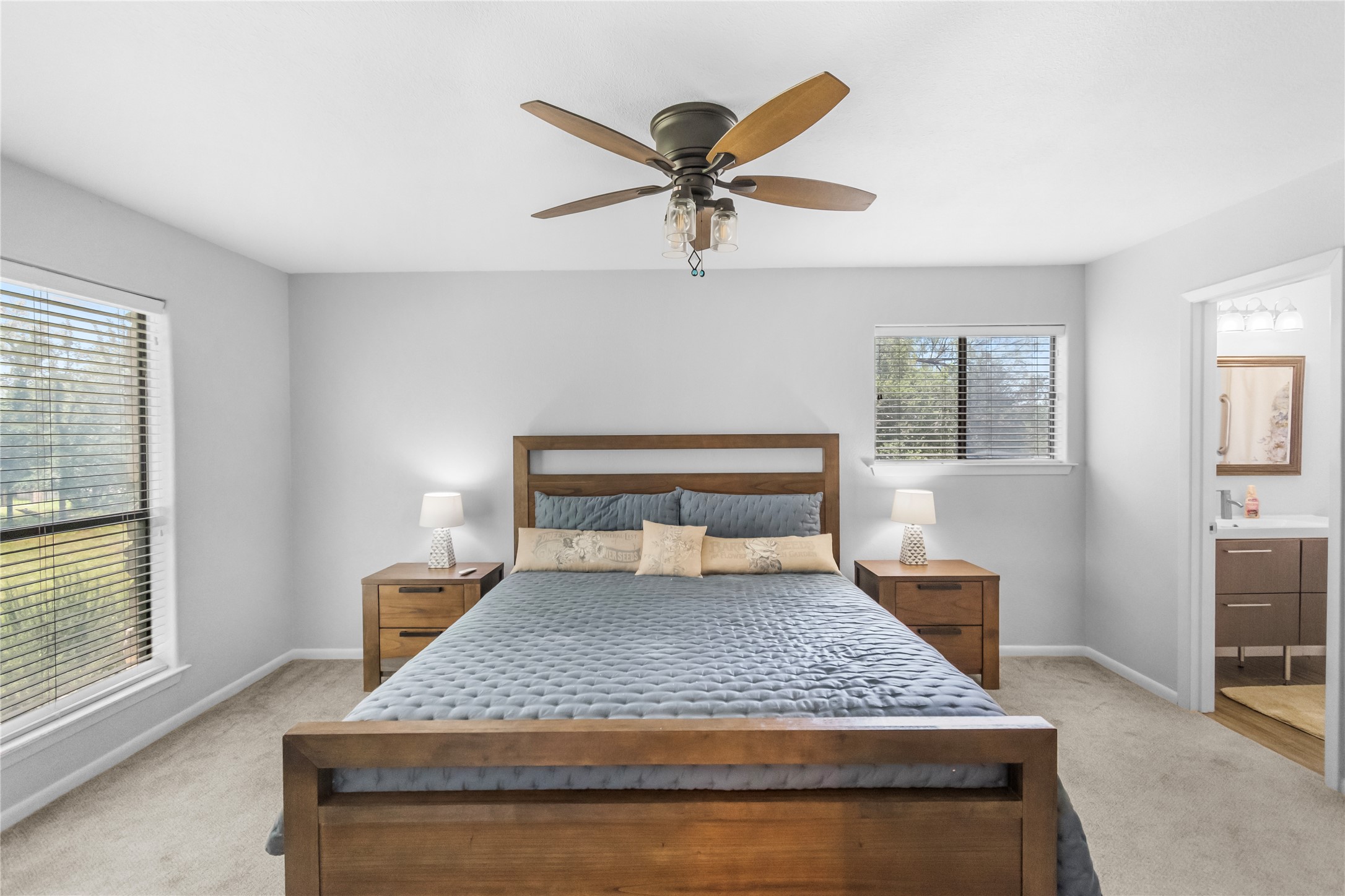 210 Teeoff, Unit B Horseshoe Bay, TX 78657 - Photo 17 of 38 A comfortable bedroom with a ceiling fan and generous natural light offers a peaceful retreat.