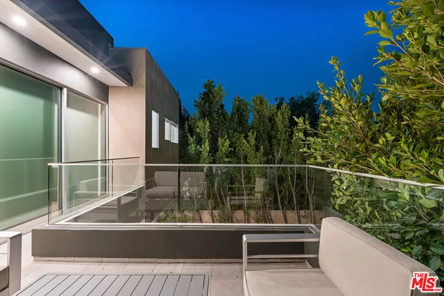 a view of a balcony with chairs