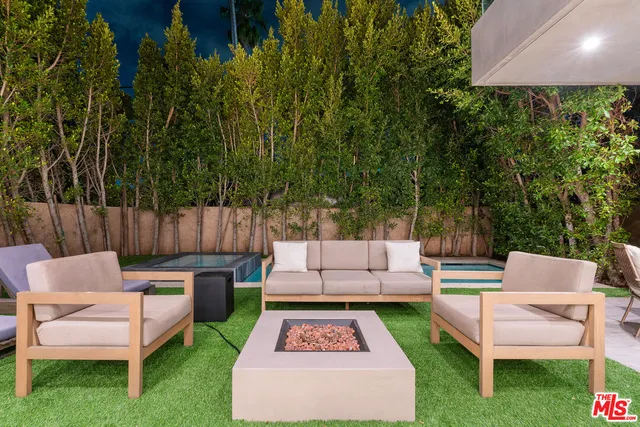 a view of a yard with furniture