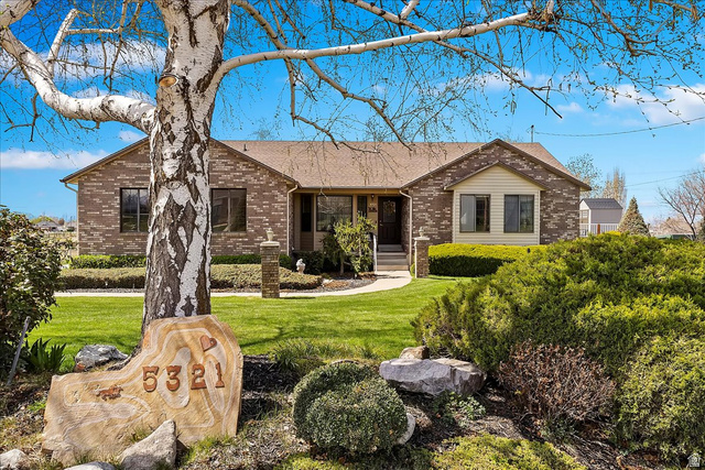 5321 South 3100th Street West Roy, UT 84067 - Photo 3 of 64 Brick exterior with a gabled roofline
