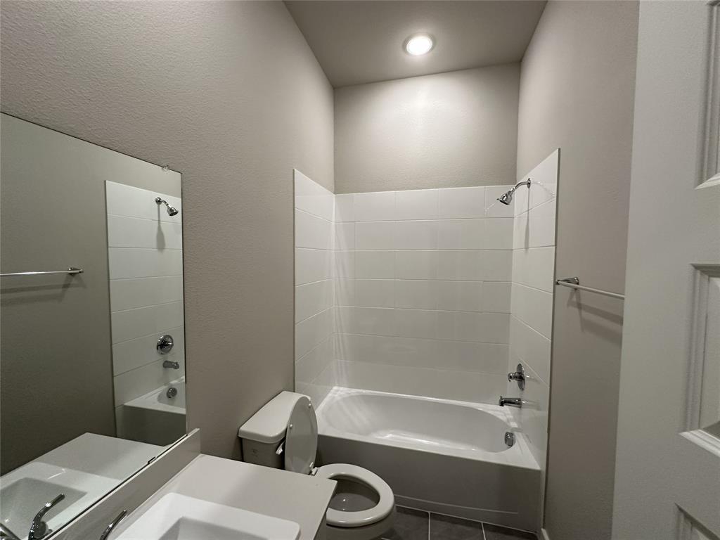 109 Lavender Street Forney, TX 75126 - Photo 8 of 15 a bathroom with a tub a sink and a shower