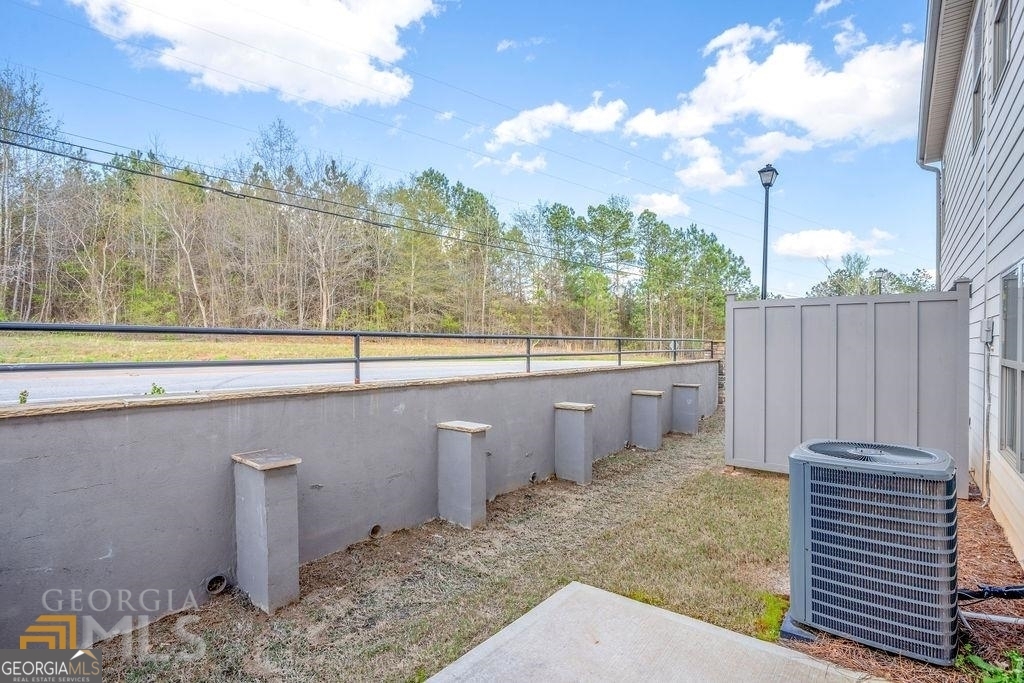 7704 Fawn Circle Covington, GA 30014 - Photo 14 of 14 a view of a backyard with sitting area