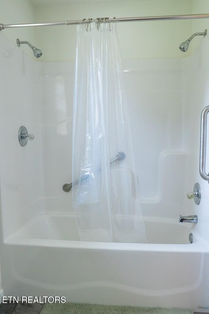 1518 Cummingsville And Sparkman Road Doyle, TN 38559 - Photo 35 of 58 a bathroom with a shower and a bath tub