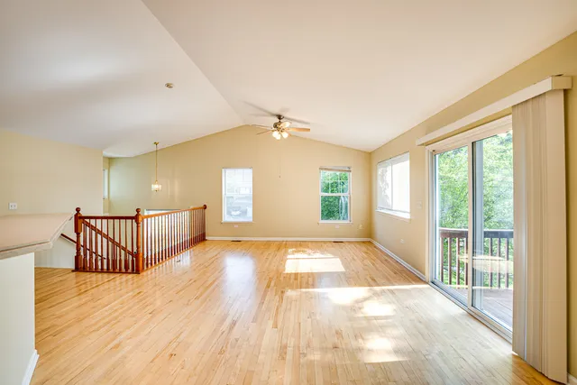 a view of an empty room with windows