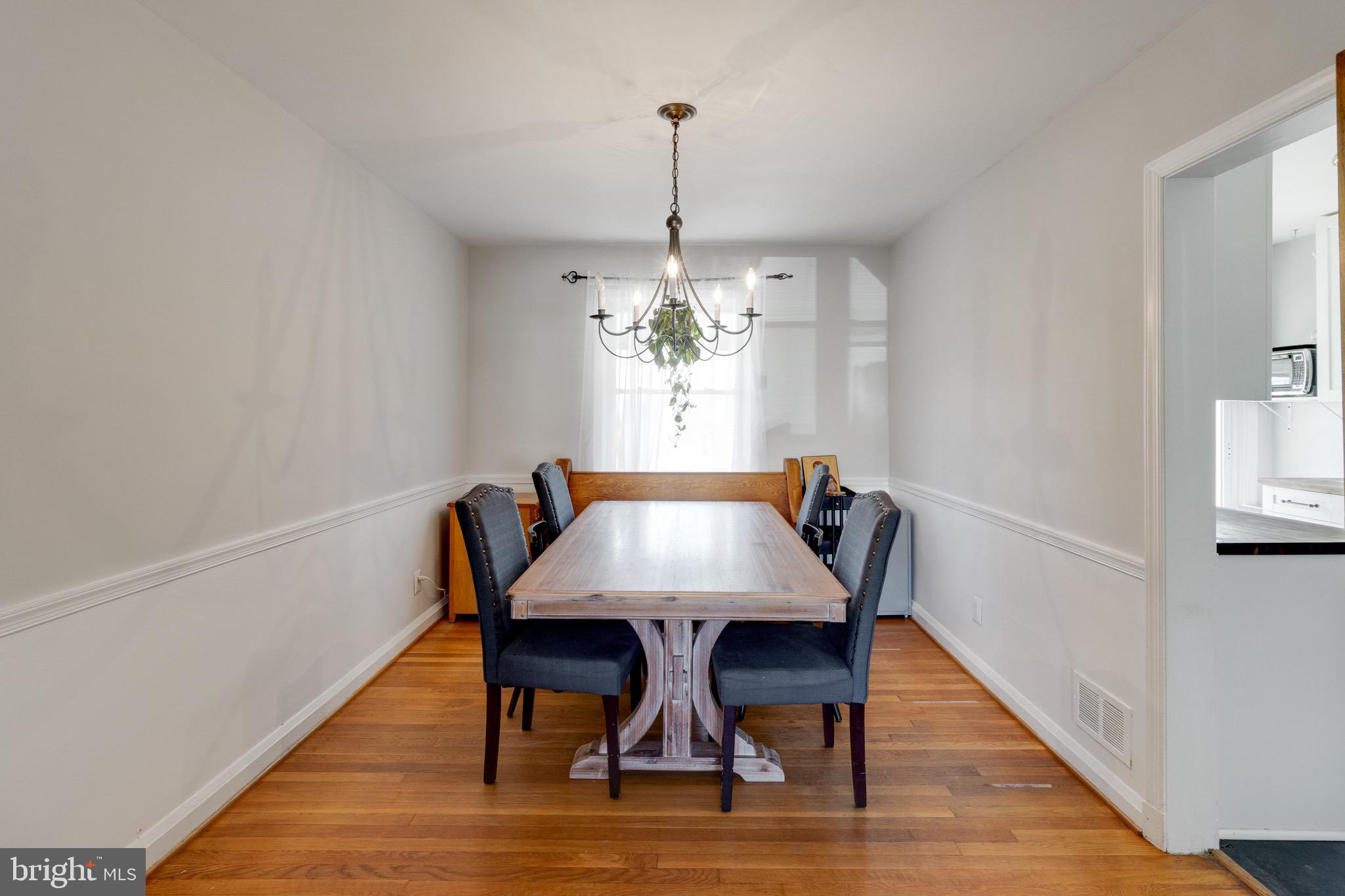 153 Garden Ridge Road Baltimore, MD 21228 - Photo 14 of 40 Formal Dining Room Open to Living Room