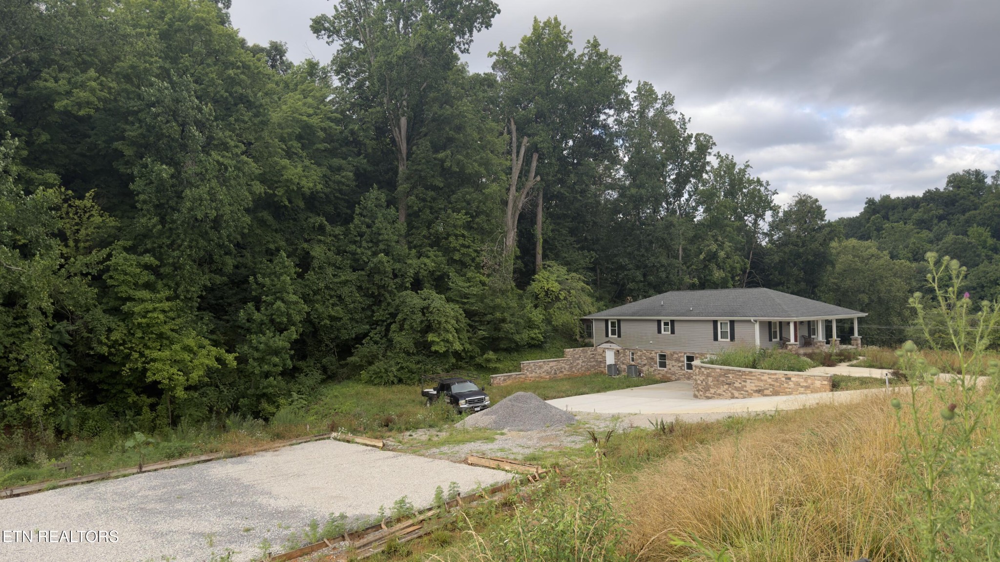 2662 Louisville Road Maryville, TN 37801 - Photo 41 of 60 a view of swimming pool with lawn chairs and large trees