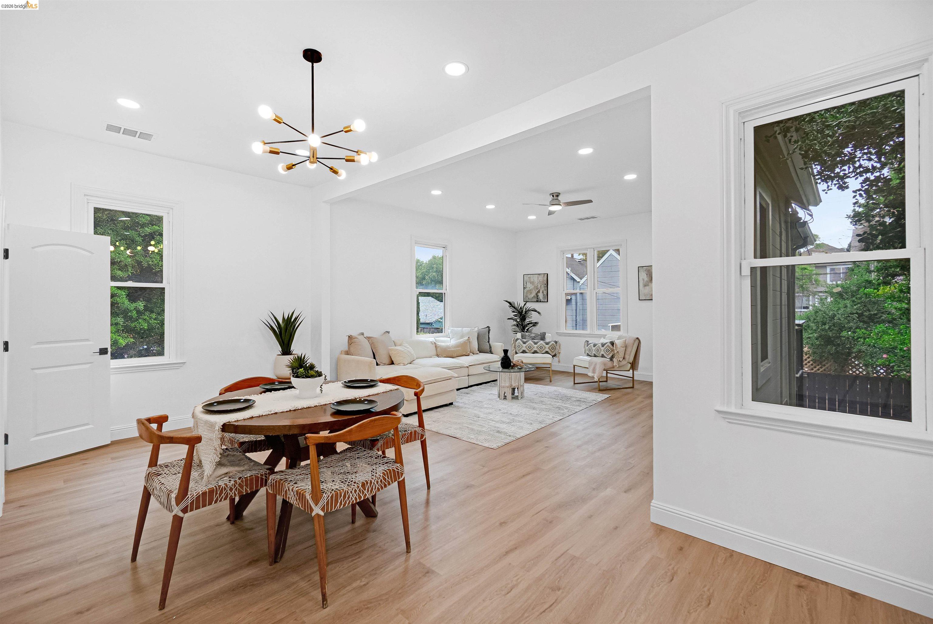 1812 Woolsey Street Berkeley, CA 94703 - Photo 10 of 48 Open-concept living space featuring wood-finish flooring, recessed lighting, and white trim throughout