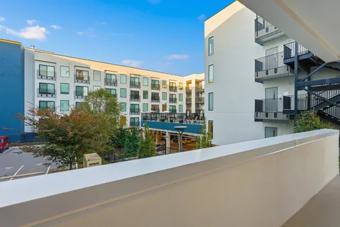 a view of balcony with furniture