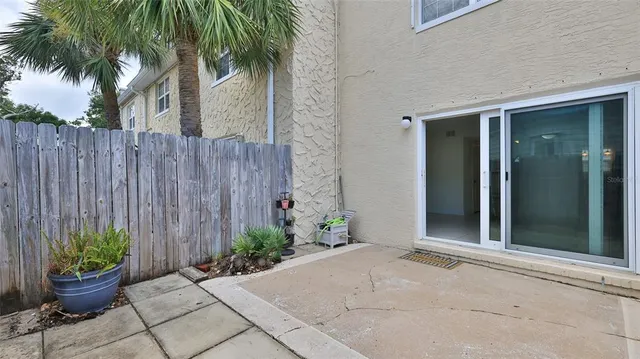 a potted plant sitting in front of a house