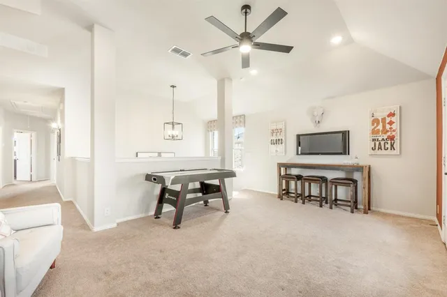 a view of a livingroom with furniture and a flat screen tv