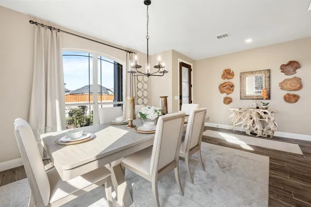 a view of a dining room with furniture window and outside view