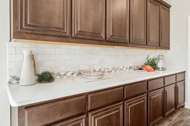 a kitchen with a sink and cabinets