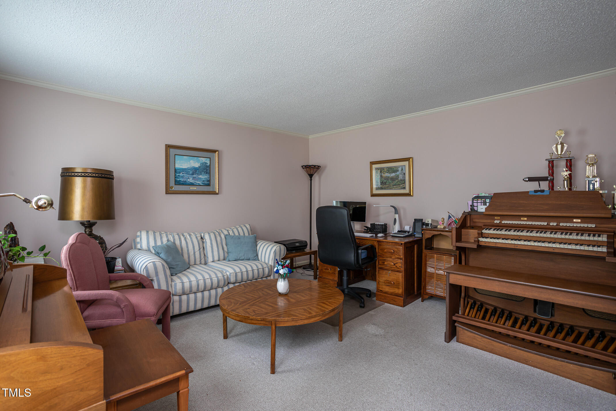 1213 Indian Trail Drive Raleigh, NC 27609 - Photo 16 of 50 a living room with furniture and a piano