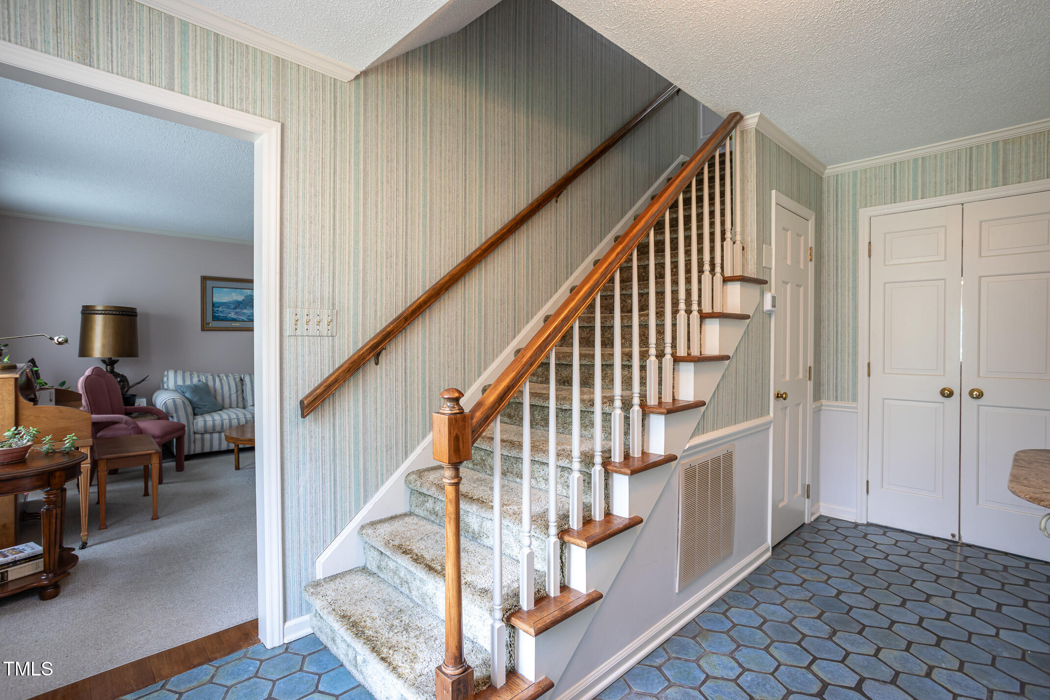 1213 Indian Trail Drive Raleigh, NC 27609 - Photo 19 of 50 a view of entryway with wooden floor and windows