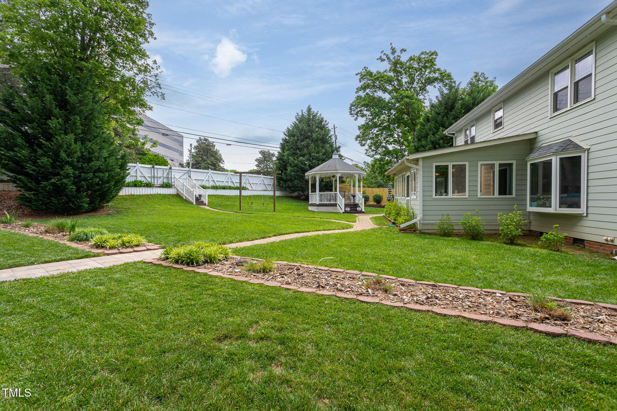 1213 Indian Trail Drive Raleigh, NC 27609 - Photo 2 of 50 a view of a house with a backyard