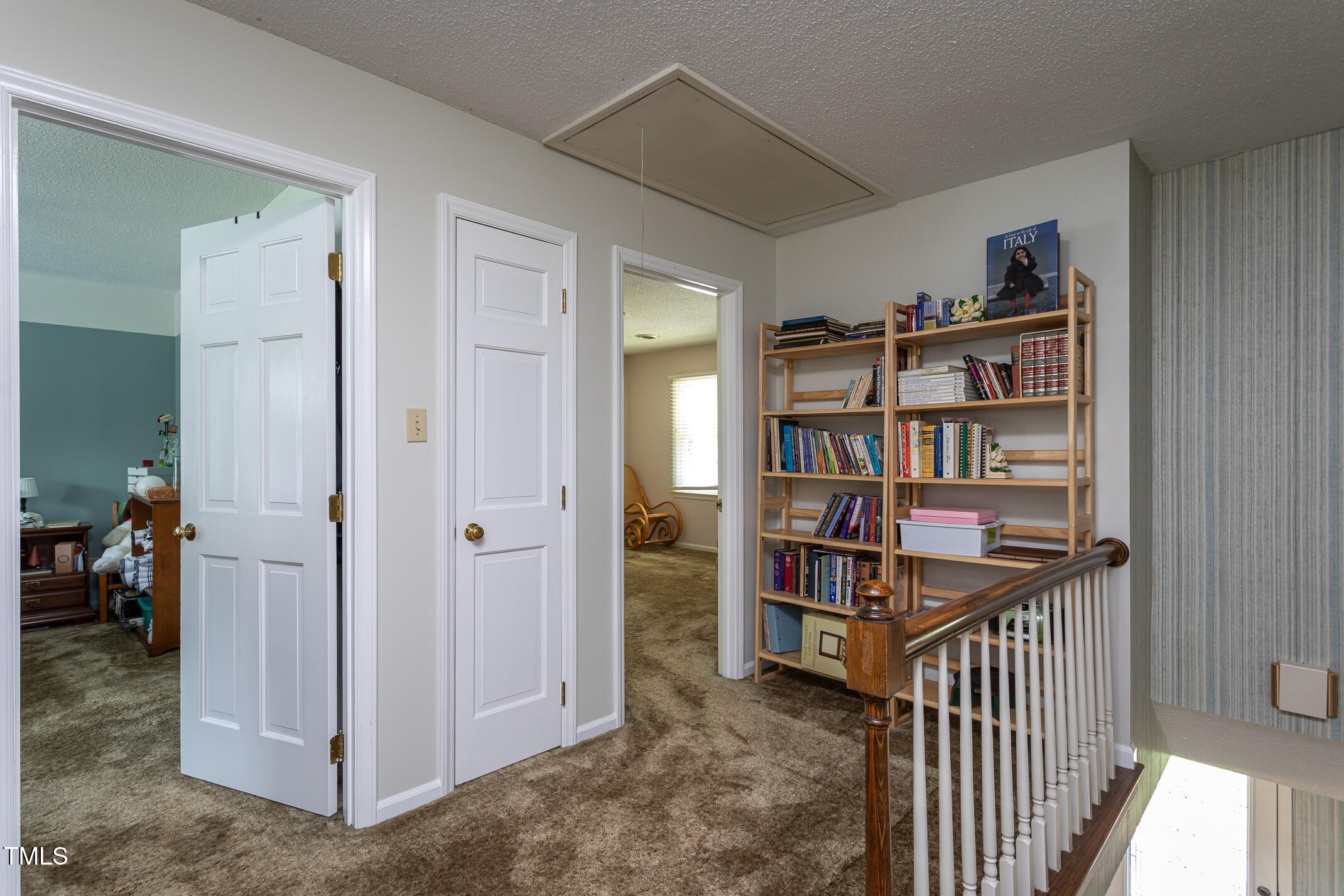 1213 Indian Trail Drive Raleigh, NC 27609 - Photo 24 of 50 a view of a livingroom with a bookshelf
