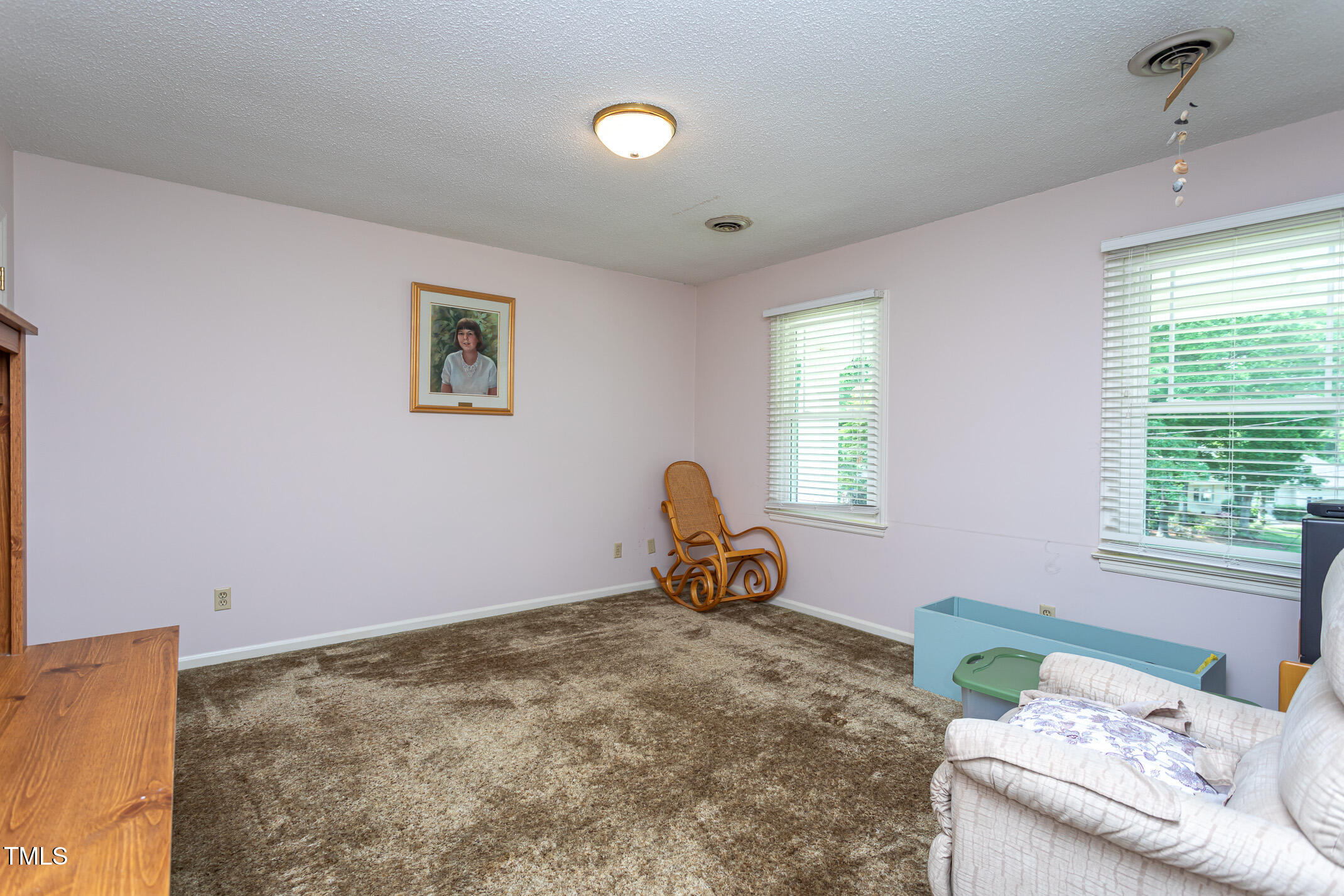 1213 Indian Trail Drive Raleigh, NC 27609 - Photo 26 of 50 a bedroom with a bed and a window